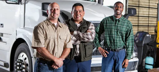 Transportation workers beside a truck